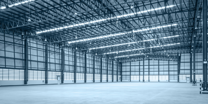 Commercial rooftop solar and battery storage installed on a large warehouse building