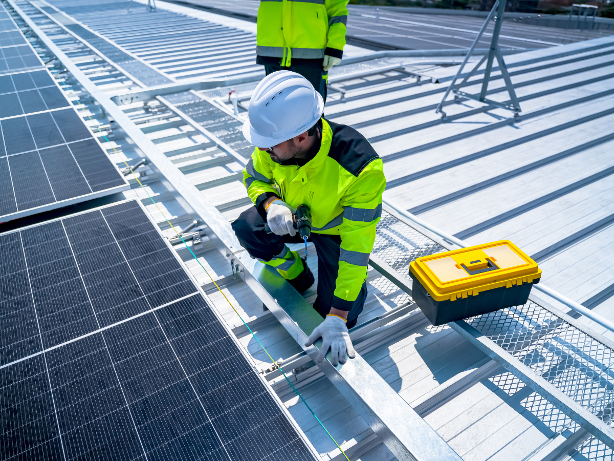 Ador Energy engineering team at a commercial solar installation site